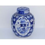 A 19thC Chinese blue & white covered ginger jar, decorated with four shaped panels depicting