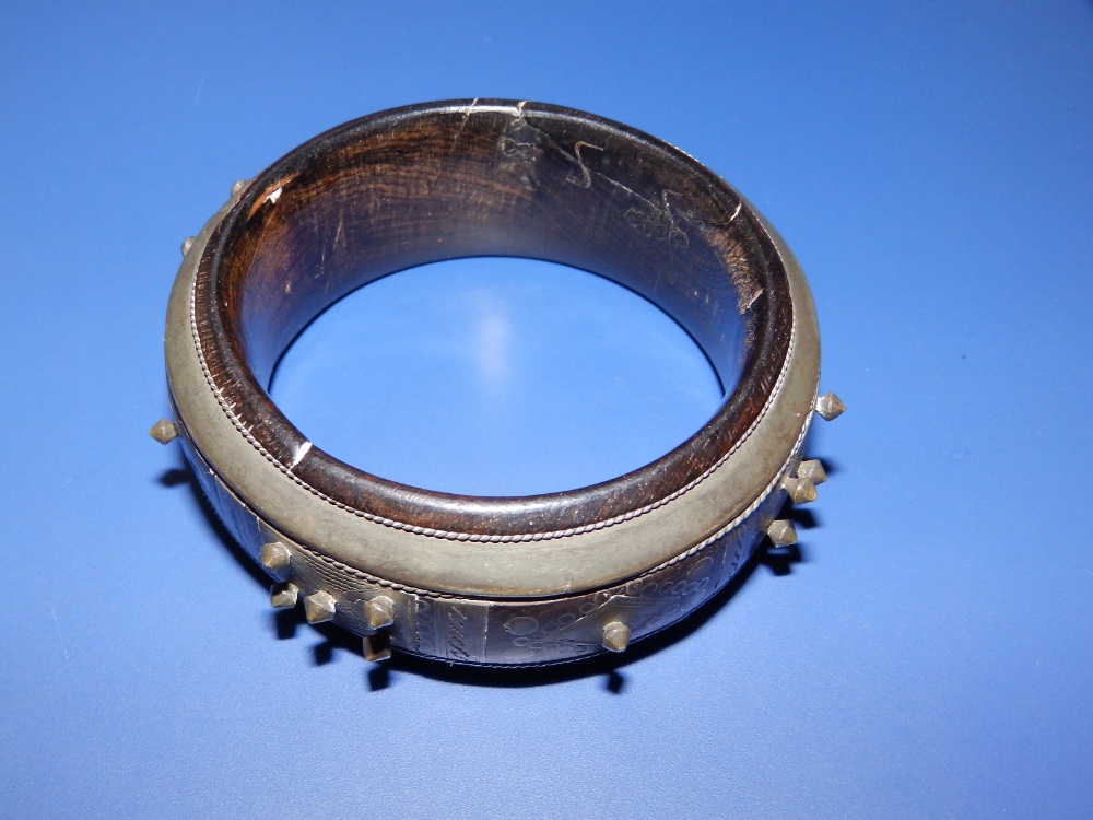 An antique lignum vitae bangle inlaid and applied with silver decoration and studding, , 3.1" - Image 3 of 4