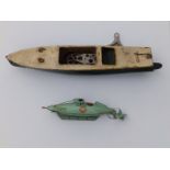 A Sutcliffe clockwork Nautilus submarine, 9.5" and a damaged clockwork speedboat. (2)