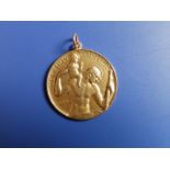 A 9ct gold St. Christopher medallion by Paul Vincze, engraved to verso 'When I am far from those I