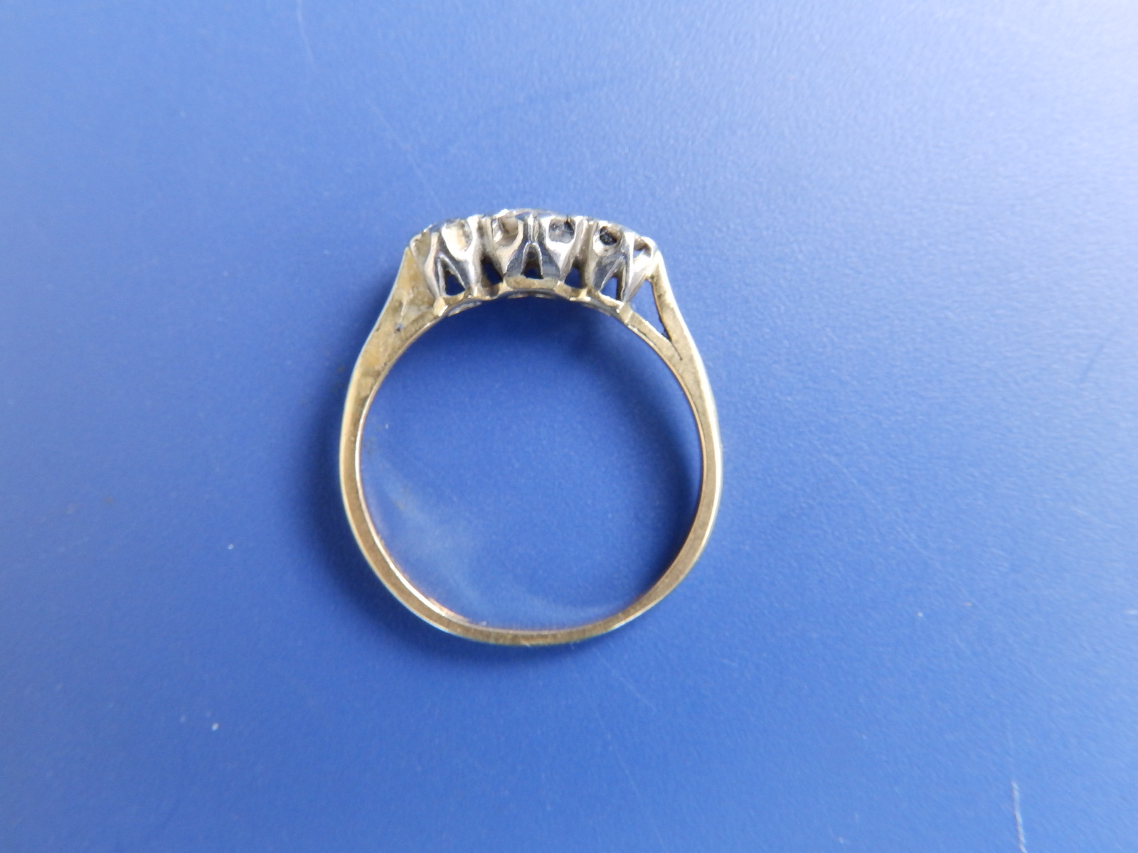 A small three stone diamond ring. Finger size L. - Image 2 of 2