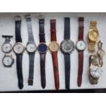 A quantity of wrist watches including a gold lady's example and an imitation Rolex.