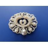 A Victorian natural saltwater & seed pearl brooch oval brooch, the numerous pearls tied to an