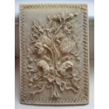 A small late 19th/early 20thC rectangular ivory plaque, finely carved in high relief to show a