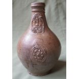 A 17thC bellarmine 'greybeard' jug, 8.5" high.