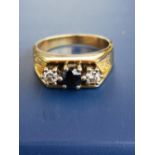 A small modern three stone sapphire & diamond ring. Finger size J.