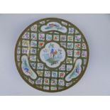 A Sevres porcelain plate, painted in polychrome with four shaped panels depicting exotic birds