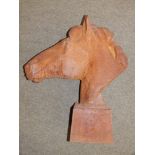 A metal horse head sculpture , 24" high.