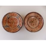 A small 17thC Hispano-Moresque pink lustre earthenware dish, decorated with panels of stylised