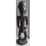 An African carved wood female figure, 21" high.
