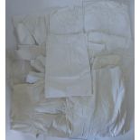 A collection of Victorian/Edwardian white linen & lace slips, skirts and related items.
