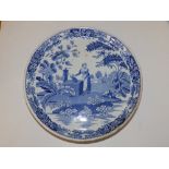 A Victorian blue & white printed earthenware low cakestand, decorated with a maiden collecting water