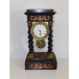 A 19thC French portico clock with spiral twist columns, the circular enamel dial damaged, base &