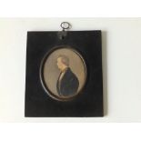 19thC School - oval watercolour miniature - Half length male portrait in profile, 3.75" high.