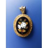 A small Victorian pietra dura oval locket, a panel of hair to reverse, 1.75" overall.