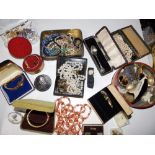 A small leather case and contents of costume jewellery.