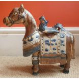 A stoneware pottery horse in Chinese Tang style, underside with impressed 'K' mark, 10" high.