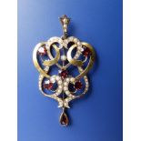 An art nouveau 9ct gold pearl & garnet set openwork pendant, 2.1" overall.