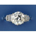An art deco diamond solitaire ring, the claw set old cut stone weighing approximately 2.3 carats,