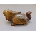 A Chinese jade carving depicting a mythical tortoise-like animal, 5" across.