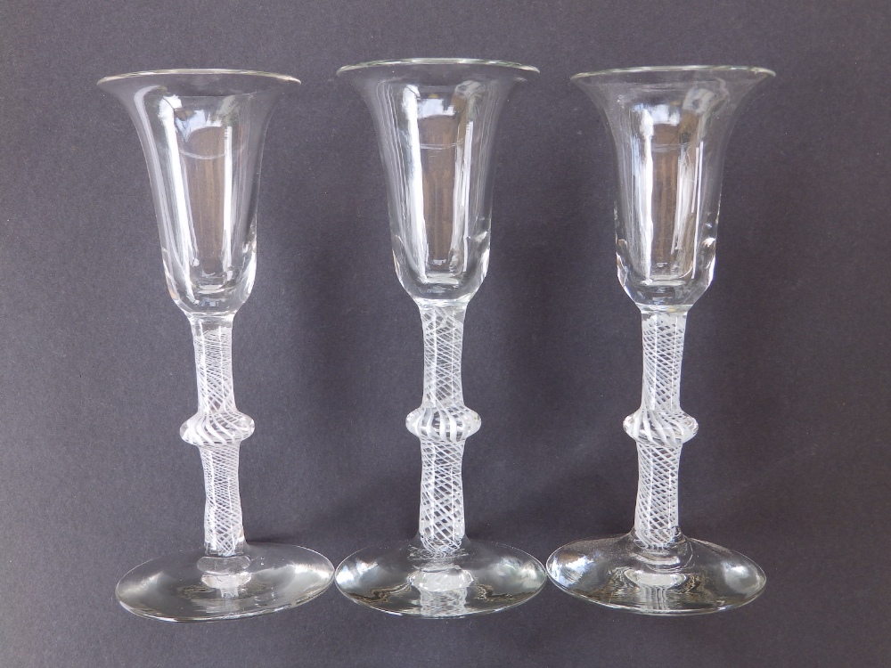 Three opaque twist wine glasses with single knop stems, 6.5".