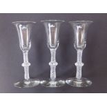 Three opaque twist wine glasses with single knop stems, 6.5".