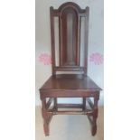 An early Georgian oak panel seated chair with arched cresting rail, Height 41.5".