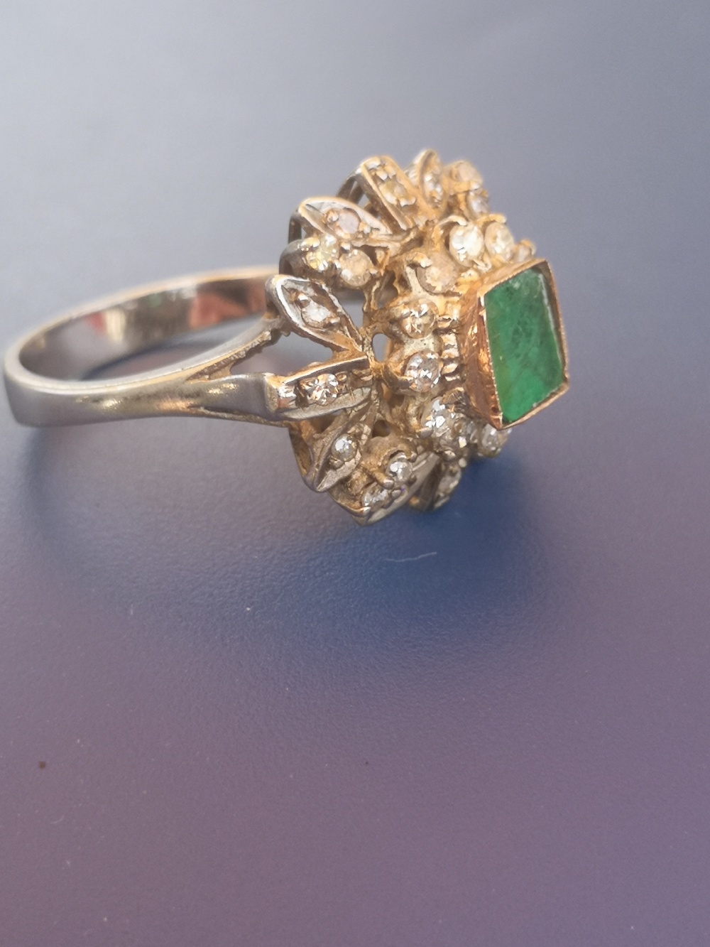 A modern emerald & diamond '750' cluster ring. Finger size P - emerald chipped. - Image 2 of 3