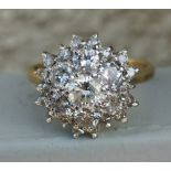 A modern diamond cluster ring on 18ct gold shank - London marks. Finger size S.