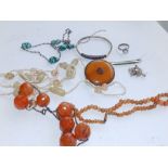 A small quantity of amber coloured and other costume jewellery