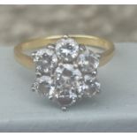 A modern diamond 'daisy' cluster ring, the seven claw set brilliants of total weight approximately