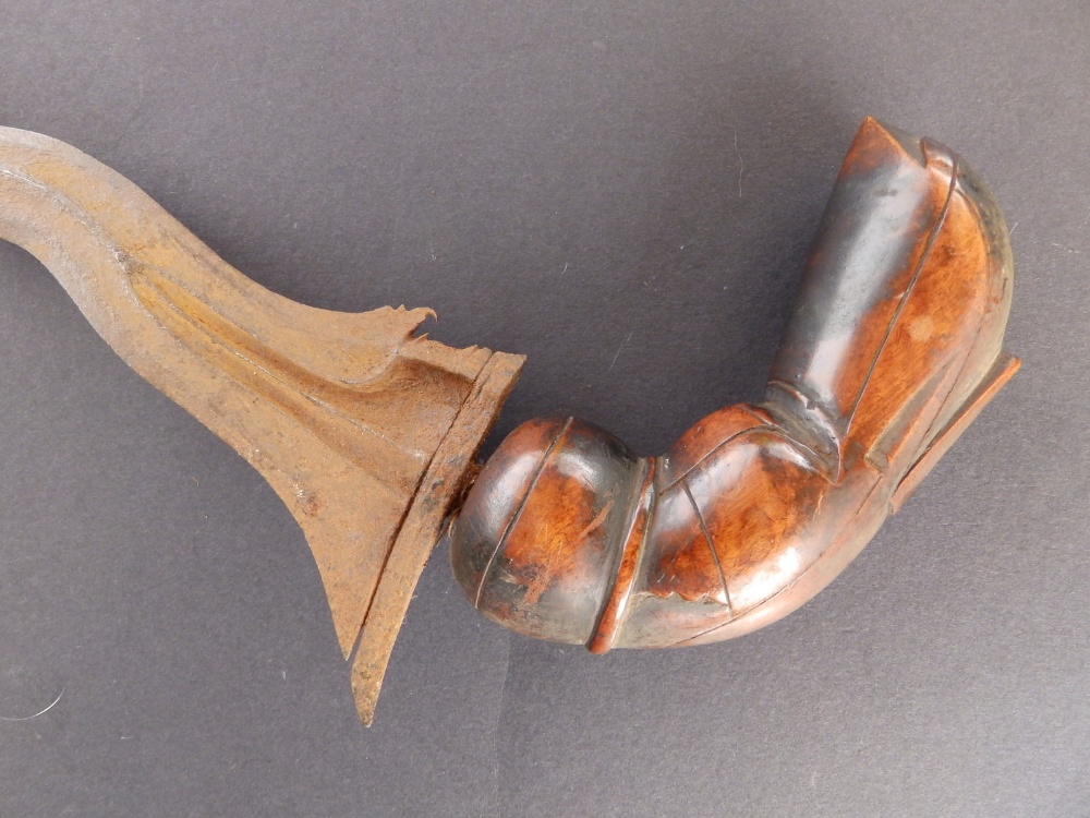 An antique kris, having wavy blade, carved wooden grip, 16" overall. - Image 4 of 6