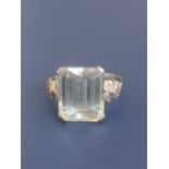 An 18ct white gold aquamarine solitaire ring, the rectangular cut stone measuring 14mm across.