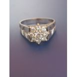 A modern diamond cluster set 18ct white gold ring. Finger size L/M.