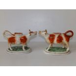 A pair of Victorian Staffordshire brown & white cow creamers, 6.5" across. (2)