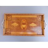 An art deco rectangular marquetry tray decorated with urns, 22.5" across handles.