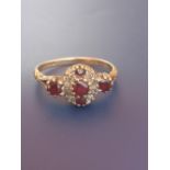 A ruby & diamond set 9ct gold ring. Finger size Q.