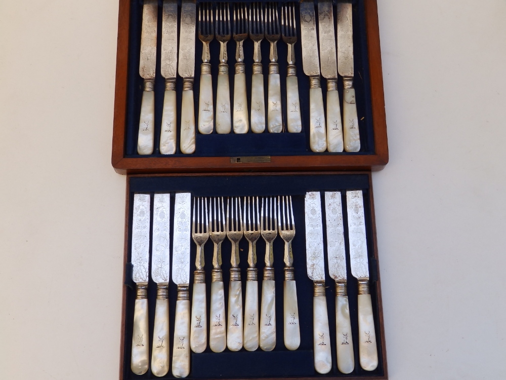 A mahogany canteen of 12 Victorian mother-of-pearl handled EP tea knives & forks - one handle