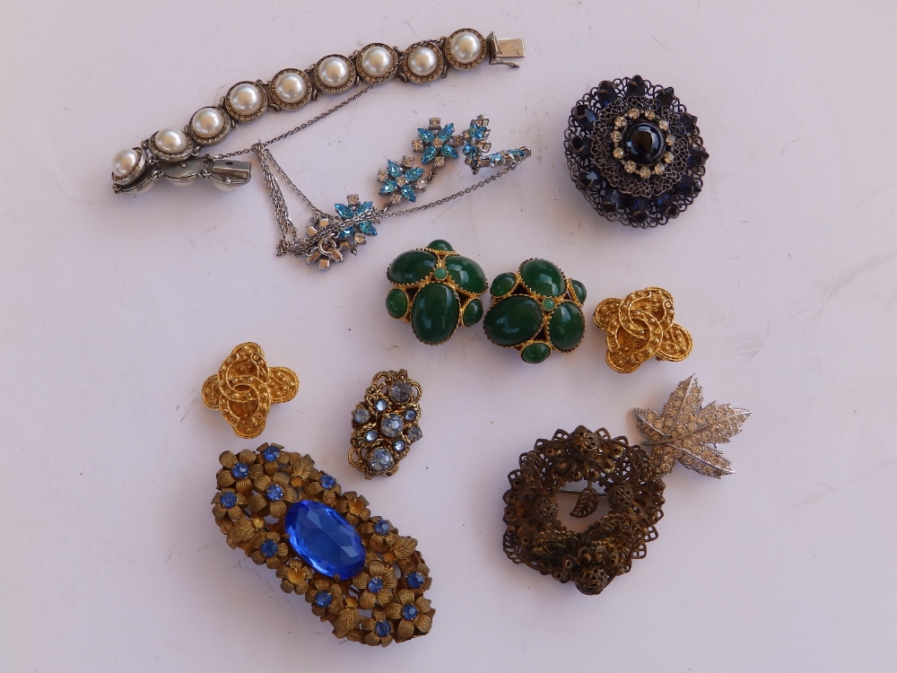 A Miriam Haskell articulated floral wreath brooch an 10 other pieces of costume jewellery.