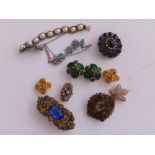 A Miriam Haskell articulated floral wreath brooch an 10 other pieces of costume jewellery.