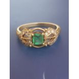 An art deco emerald & diamond set 18ct gold ring, having central suare cut emerald. Finger size N.