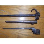 A French bayonet in scabbard - 'RP 96170', 21.5" overall, and an Enfield type bayonet. (2)