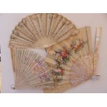 A 19thC cream silk leaf fan decorated with sequins and two painted leaf fans - all in boxes and a/f.