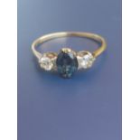 A three stone sapphire & diamond 18ct gold ring. Finger size Q/R.