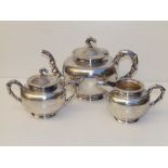 A Chinese three piece silver tea service, having bamboo moulded handles and spout to teapot, the