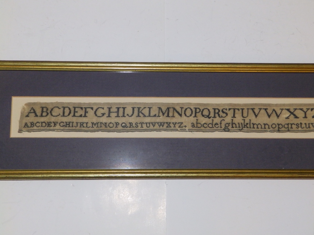 A George IV black silkwork alphabet sampler with numerals, worked by H. Drewett, 1825, 1.5" x 25". - Image 3 of 3