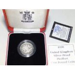 A cased UK silver proof 1998 Piedmont one pound coin, a small quantity of modern coins and other