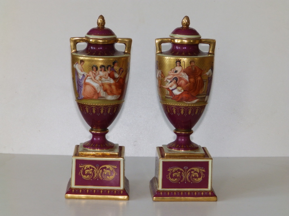 A pair of Vienna porcelain two-handled vases of urn shape on square pedestal bases, the sides - Image 2 of 14