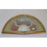 An elaborate 19thC mother-of -pearl fan, the guard set with a gilt frame oval mirror, the silk