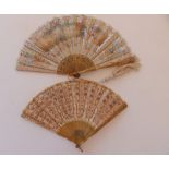 A 19thC painted silk fan decorated with sequins and depicting a serenade, 16" across in Tiffany box,